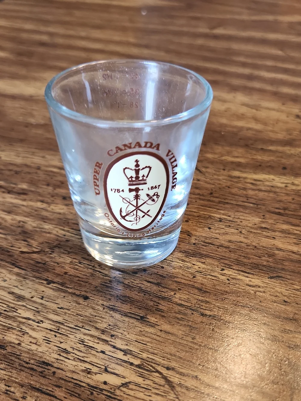 Upper Canada Village Crest Shot Glass - Clear with Maroon Logo